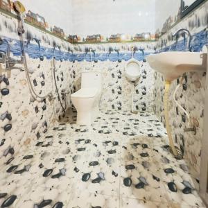 a bathroom with a toilet and a sink at Tulsipur Agro Park in Mirzāpur