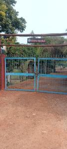 a blue fence with a horse inside of it at Tulsipur Agro Park in Mirzāpur