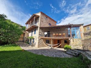 an exterior view of a house with a patio at Villa lavaudieu in Lavaudieu