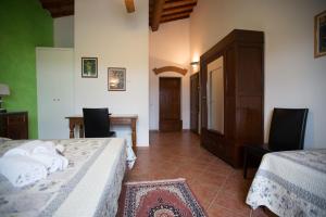 Posteľ alebo postele v izbe v ubytovaní Agriturismo Villani Poderi Nesti & Cupoli