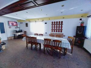 a dining room with a table and chairs at Vacation Home Yoanna in Tryavna