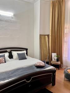 a bedroom with a large bed and a window at Himora in Gupta Kāshi
