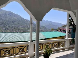 a view of a building with a green roof at Himora in Gupta Kāshi