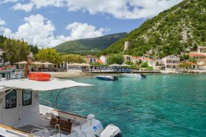 a boat is docked in a body of water at Studio Liana in Frikes