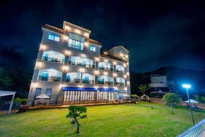 a large building with lights on it at night at Suncheon raon house egyeon pension in Suncheon