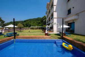 a swimming pool with a plastic raft in a building at Suncheon raon house egyeon pension in Suncheon +41 photos