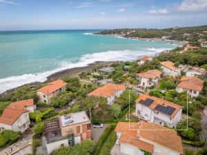 an aerial view of a town with the ocean at Villa Atusca - Castiglioncello in Castiglioncello