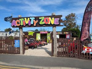 an adult zoo sign in front of a fence at PMH rental in Saint Osyth