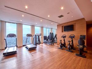 a gym with treadmills and exercise equipment in a building at Nagoya Prince Hotel Sky Tower in Nagoya