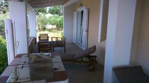 a balcony with a table and chairs on a house at Apartment Marijo in Ist