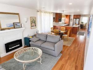 a living room with a couch and a table at Elegant Cambridge Room, Short Walk to Harvard in Cambridge