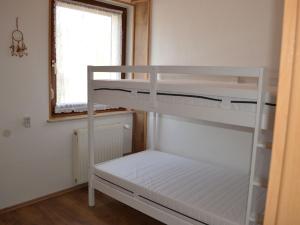 a room with two bunk beds and a window at Ferienwohnung Selkeblick in Falkenstein