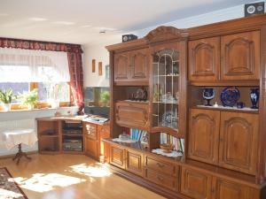 a large wooden cabinet in a room at Ferienwohnung Selkeblick in Falkenstein