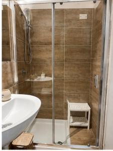 a bathroom with a shower and a sink at White Charme Rooms -Self Check in- in Alghero +32 photos