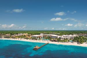 an aerial view of a resort on a beach at Secrets Aura Cozumel - Adults Only in Cozumel