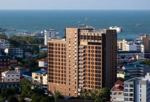a view of a large building in a city at Samsara Hotel Pattaya in Pattaya South