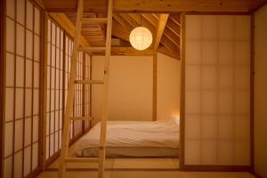a room with a bunk bed in a room with windows at Villa 天ツ星 in Tahara +115 photos