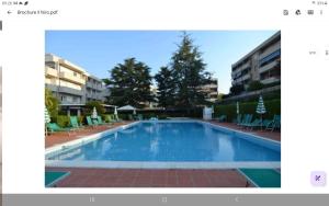 a picture of a swimming pool in a building at Rifugio del Mare con piscina e palestra in Loano