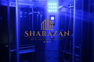 a bathroom with a shower with the sharmaarma logo on it at Sharazan in Canicattì