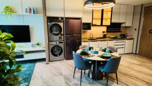 a kitchen with a table and chairs in a room at Imperial KLCC Residences in Kuala Lumpur