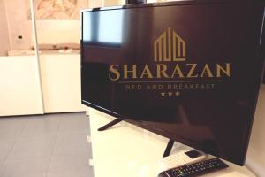 a computer monitor sitting on a table with a keyboard at Sharazan in Canicattì
