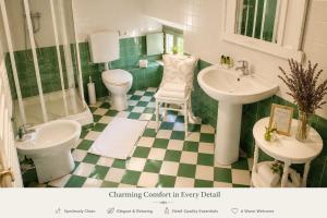a green and white bathroom with a toilet and sink at Aurisina residence in Aurisina +7 photos