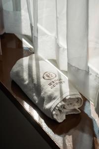 a towel sitting on a table next to a window at Wangs Hotel Gurney Drive in George Town +41 photos