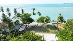 an aerial view of a beach with palm trees at Maraleina Sports Resort in Nathon Bay