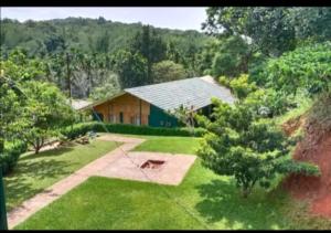 an aerial view of a house in the middle of a yard at Whispering Willows in Gūdalūr