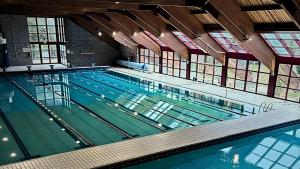 a large swimming pool with green water at Col Di Metino - Umbria in Gualdo Tadino +37 photos