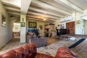 a living room with a couch and a table at All'ombra della quercia in Fano