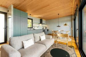 a living room with a couch and a table at Casa da Faia in São Roque do Pico