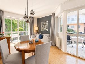 a dining room with a table and chairs at Tivoli Apartments in Bad Reichenhall