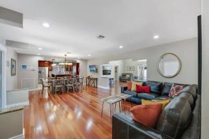 a living room with a couch and a table at Home with pool by Dream Vacation in Fort Lauderdale +41 photos
