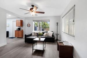 a living room with a couch and a ceiling fan at Peacock Villa 2 by Dream Vacation in Fort Lauderdale +40 photos
