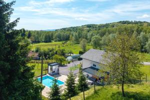 an aerial view of a house with a swimming pool at 4 bedroom home Sigma in Zlatar
