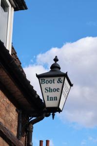 a sign on the side of a building at Boot & Shoe in Flintham +9 photos