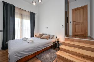 a bedroom with a bed with white sheets and a window at 4 bedroom home Sigma in Zlatar +40 photos