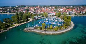 an aerial view of a marina with boats in the water at Bodenseehäusle in Immenstaad am Bodensee +25 photos