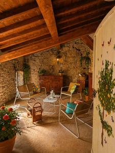a room with chairs and a table in a building at Limonaia in Villa Viani +7 photos