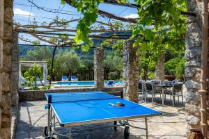 a ping pong table on a patio at Villa Cal Apostol in Pollença