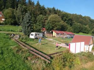 two people playing a game of tennis in a field at Camping Erzhütte in Rechenberg-Bienenmühle