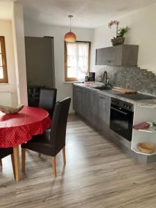 a kitchen with a table and a counter top at Ferienwohnung Haubitz in Borna
