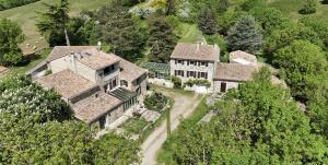 an aerial view of a large house with trees at Domaine des Goudis in Bouisse