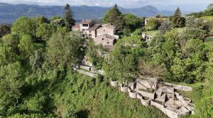 an old house on the side of a hill at Domaine des Goudis in Bouisse +13 photos
