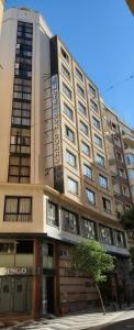 a large building with a sign on the front of it at Hotel Don Curro in Málaga