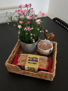a basket of food and flowers on a table at Builth wells stay in Builth Wells