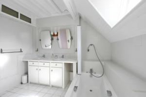 a white bathroom with a sink and a shower at La Bulle in Verton +35 photos