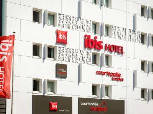 a building with lots of signs on it at ibis Marseille Timone in Marseille