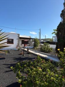 a house with a lot of flowers in front of it at myplace in Tiagua